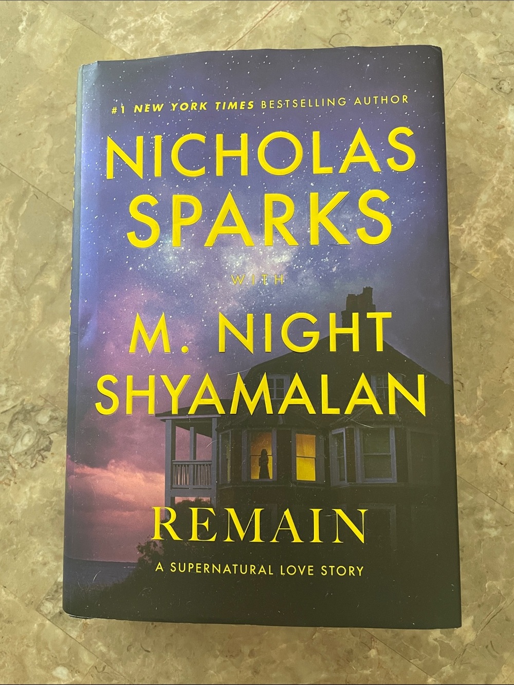 Hardcover book by Nicholas Sparks with M. Night Shyamalan titled “Remain”
